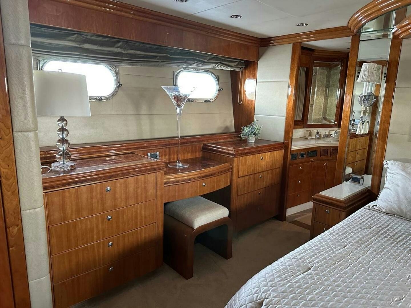 a bedroom with a bed and a desk aboard MOJITO Yacht for Sale