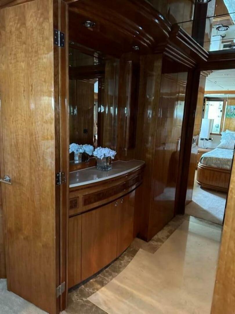 a wood cabinet in a room aboard MOJITO Yacht for Sale