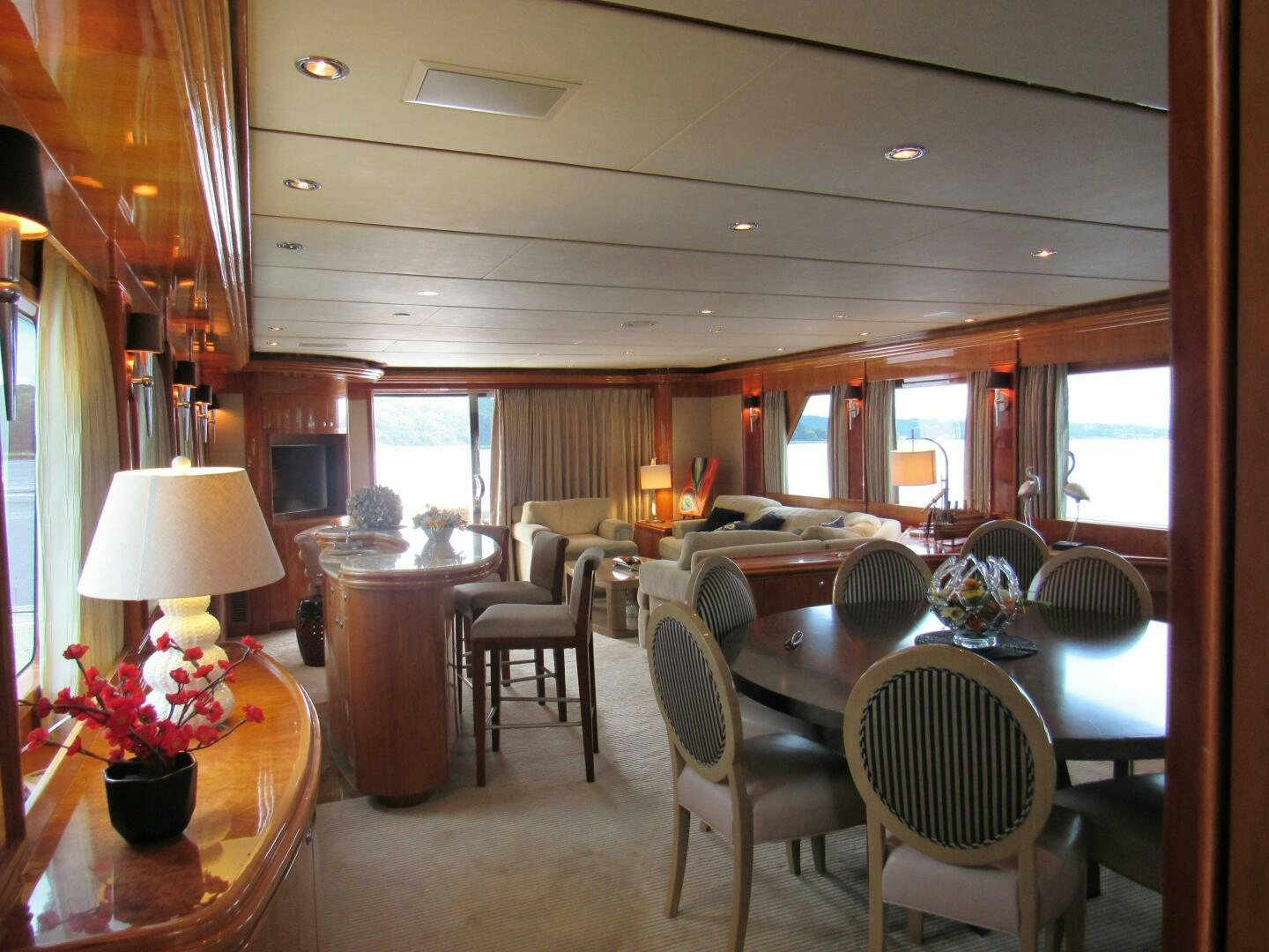 a dining room with a table and chairs aboard MOJITO Yacht for Sale