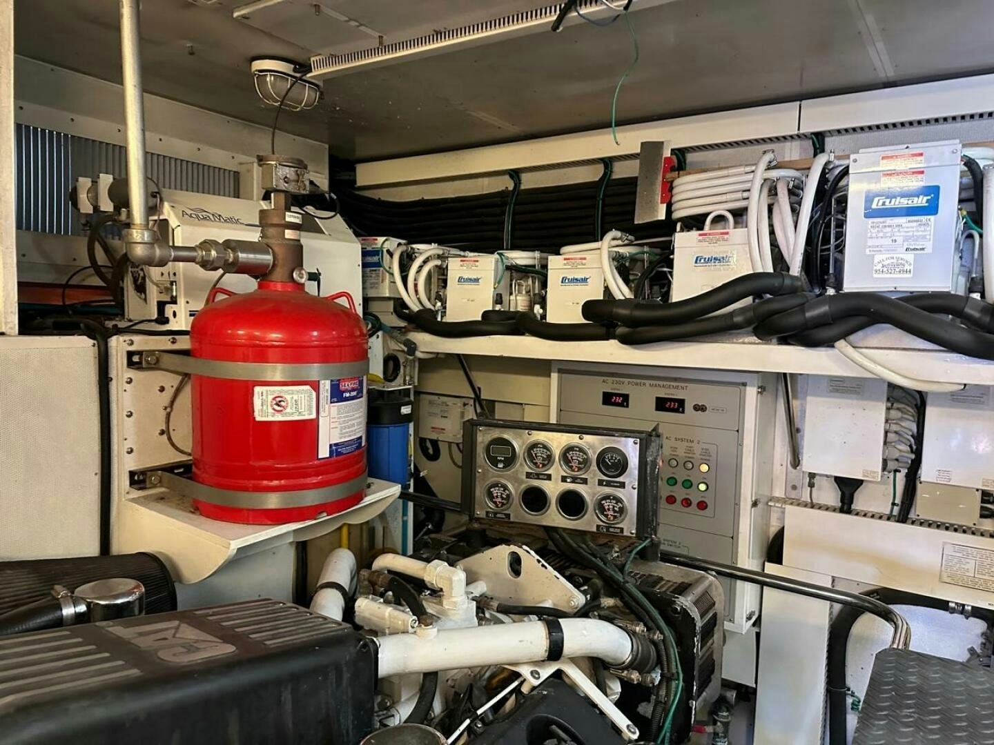 a red and white cylinder in a factory aboard MOJITO Yacht for Sale