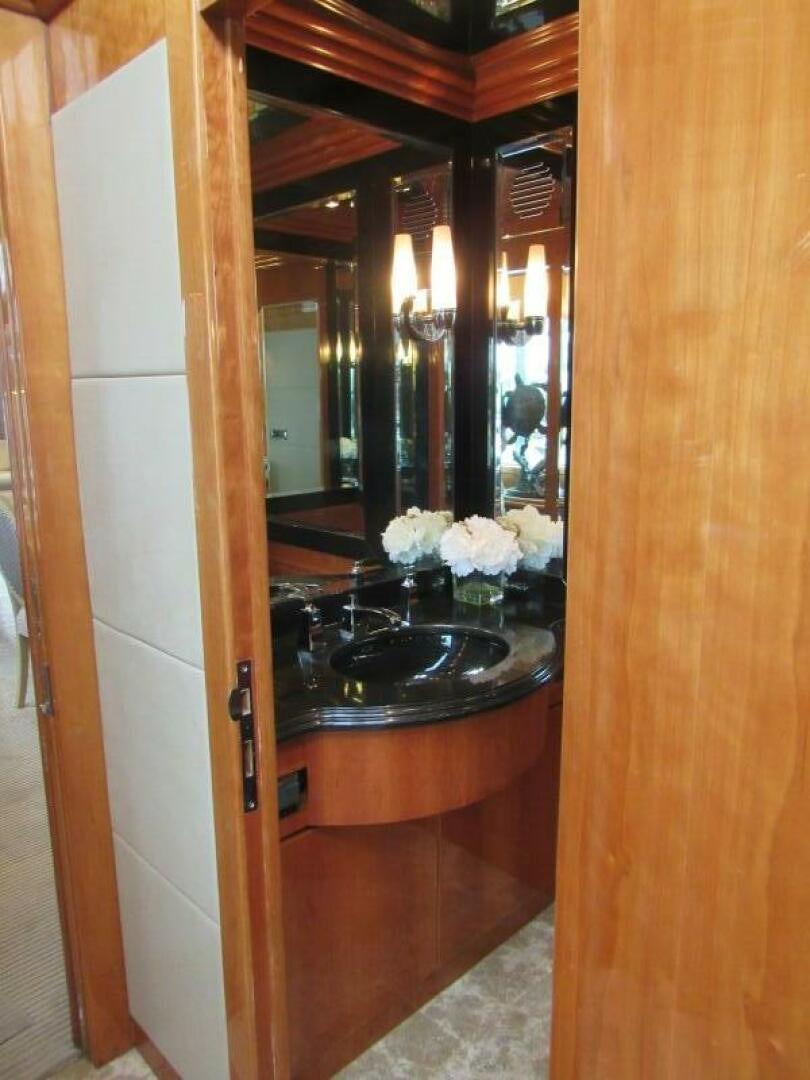 a bathroom with a large mirror aboard MOJITO Yacht for Sale