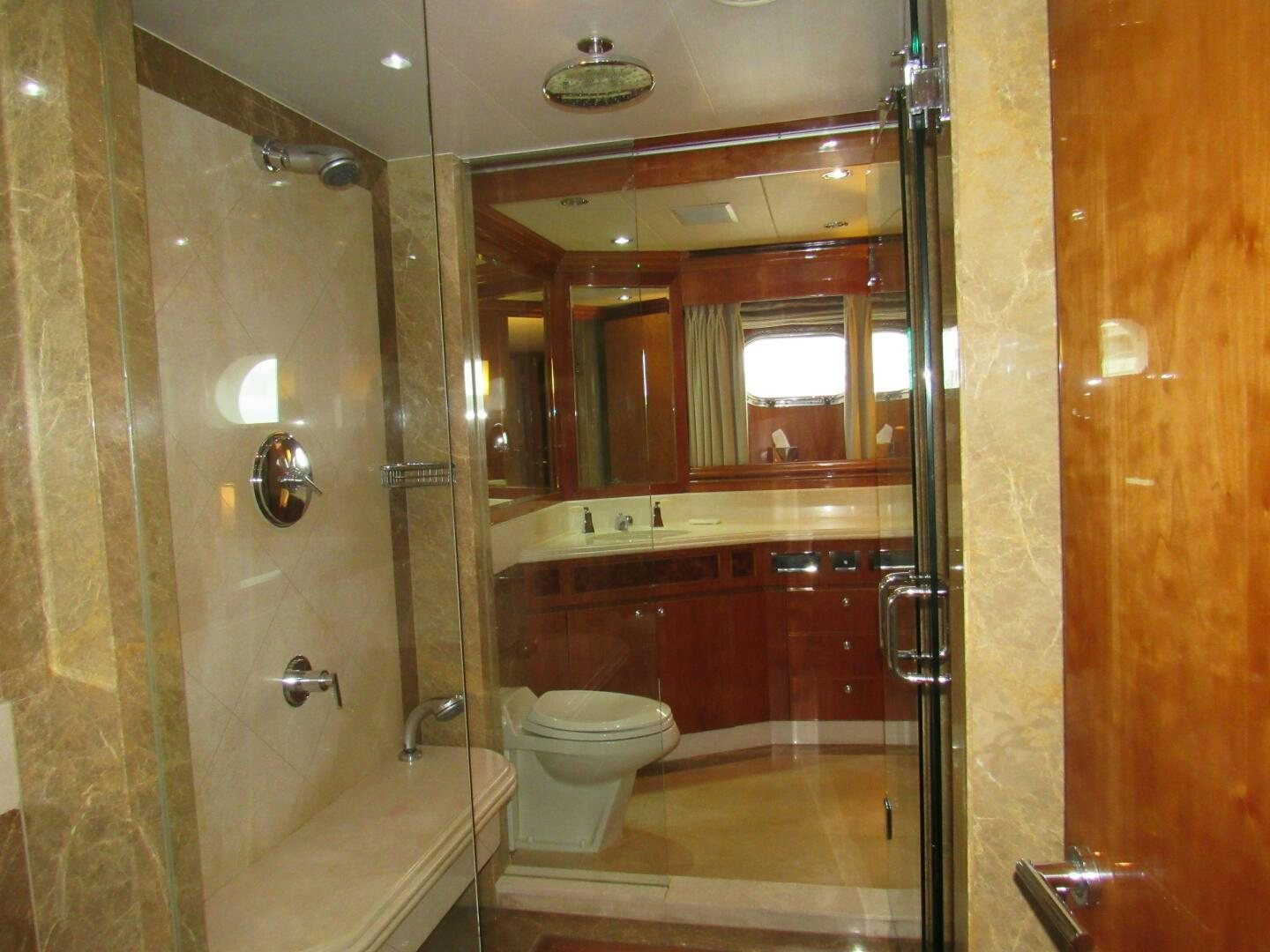 a bathroom with a glass shower aboard MOJITO Yacht for Sale