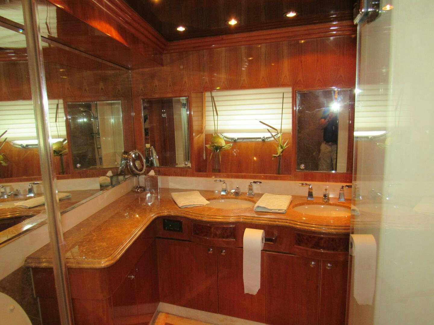 a bathroom with a large mirror aboard MOJITO Yacht for Sale