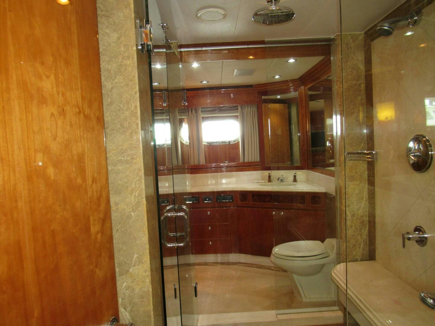 a bathroom with a glass shower aboard MOJITO Yacht for Sale