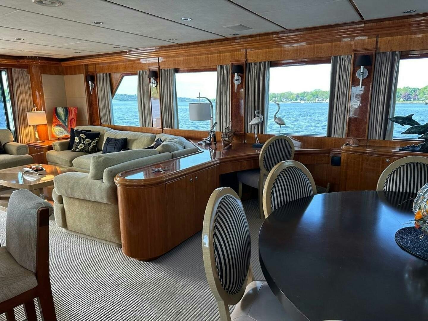 a living room with a couch and a table aboard MOJITO Yacht for Sale
