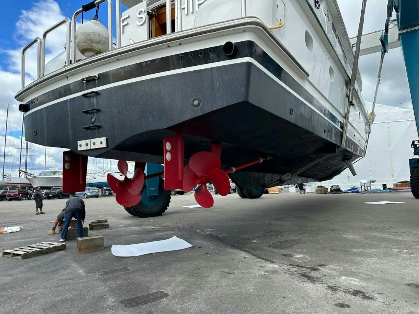a large boat on a trailer aboard MOJITO Yacht for Sale