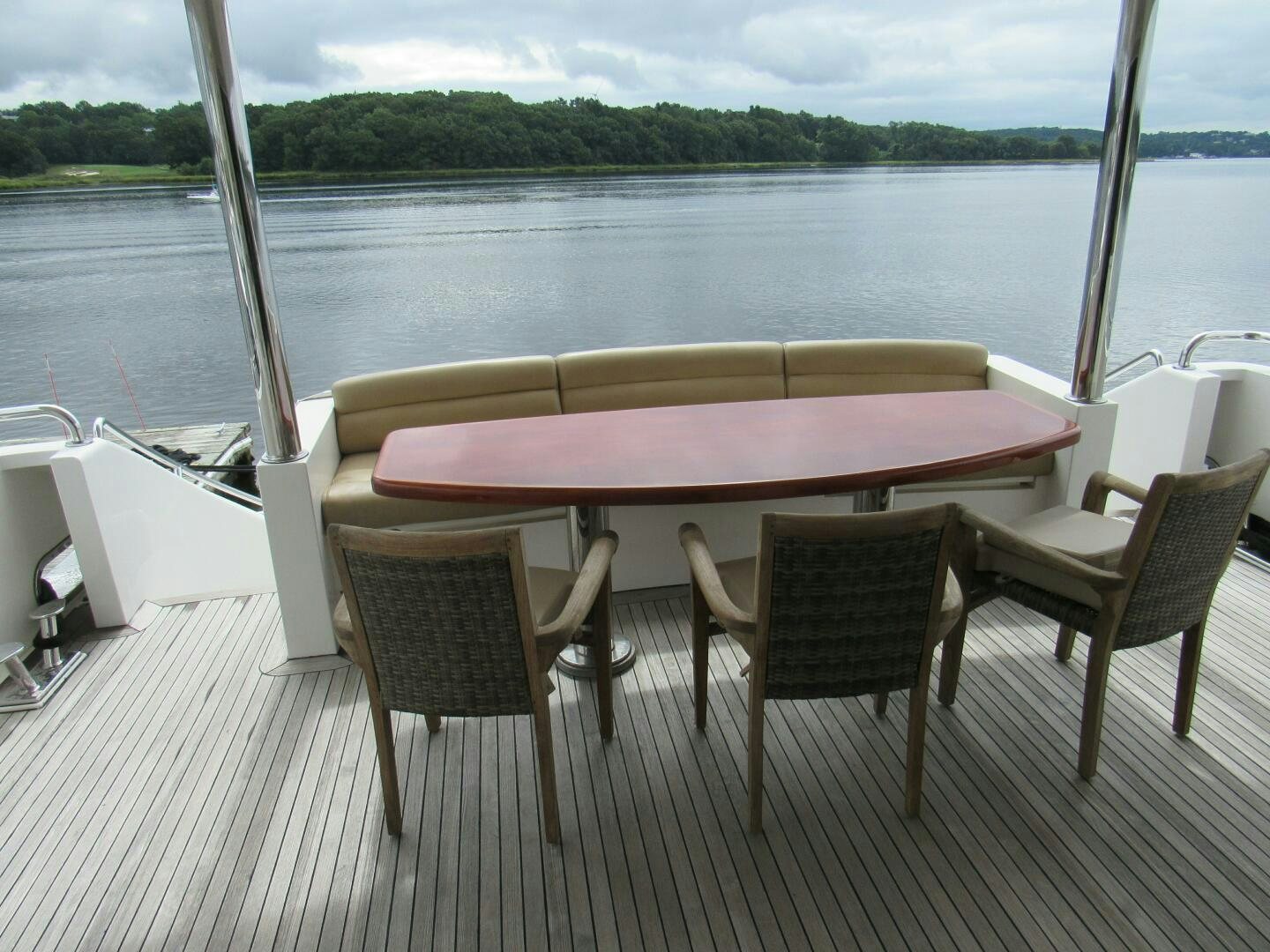 a table and chairs on a boat aboard MOJITO Yacht for Sale