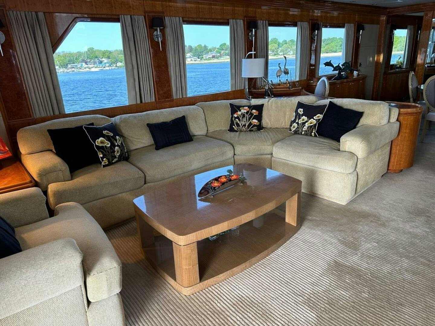 a living room with a couch and a table aboard MOJITO Yacht for Sale