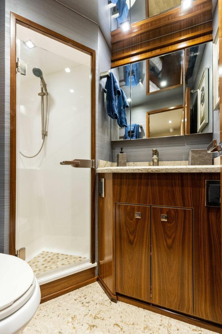 a bathroom with a large mirror aboard WHISKEY PAPA Yacht for Sale