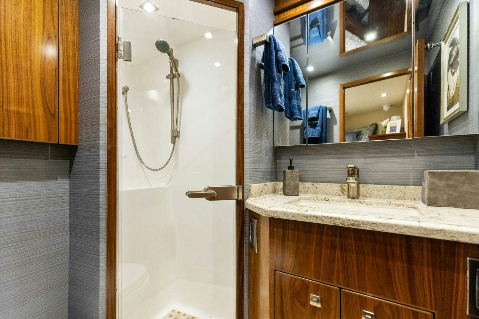 a bathroom with a large mirror aboard WHISKEY PAPA Yacht for Sale