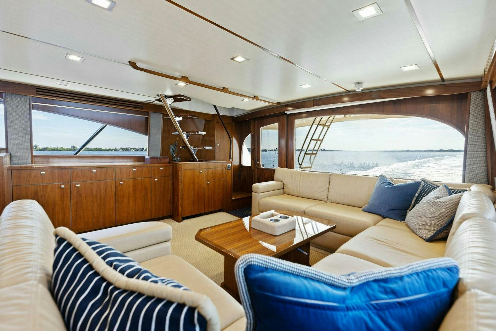 a room with a couch and a table aboard WHISKEY PAPA Yacht for Sale