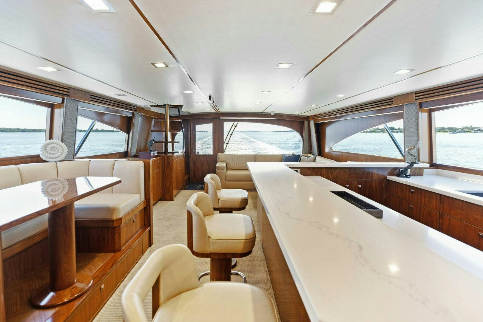 a room with a table and chairs aboard WHISKEY PAPA Yacht for Sale