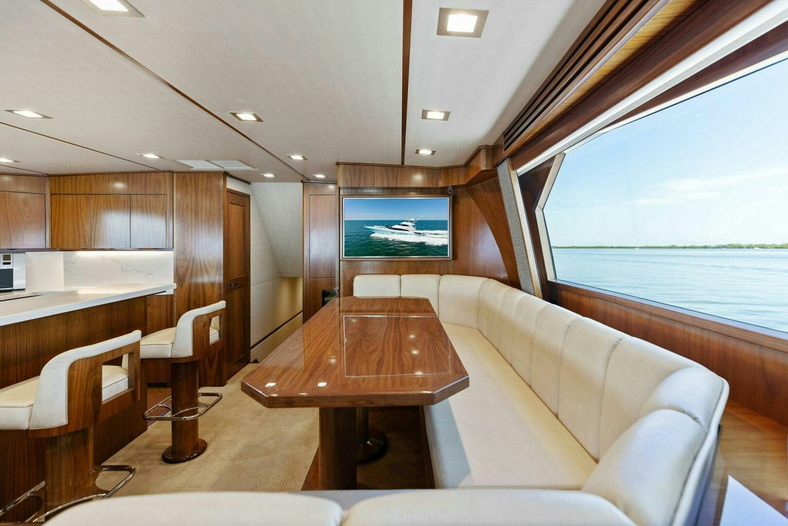 a room with a table and chairs aboard WHISKEY PAPA Yacht for Sale