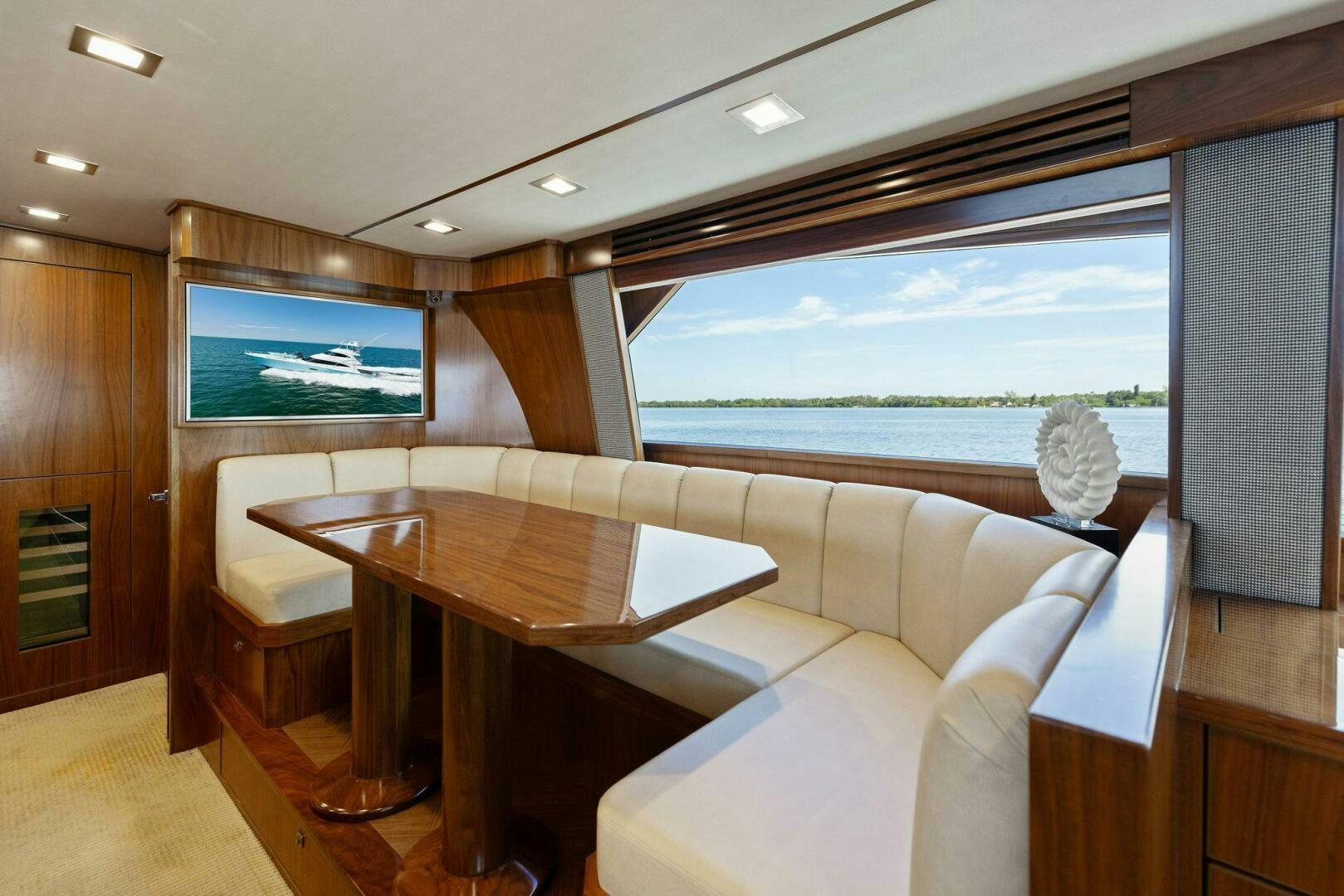 a room with a couch and a table and a tv aboard WHISKEY PAPA Yacht for Sale