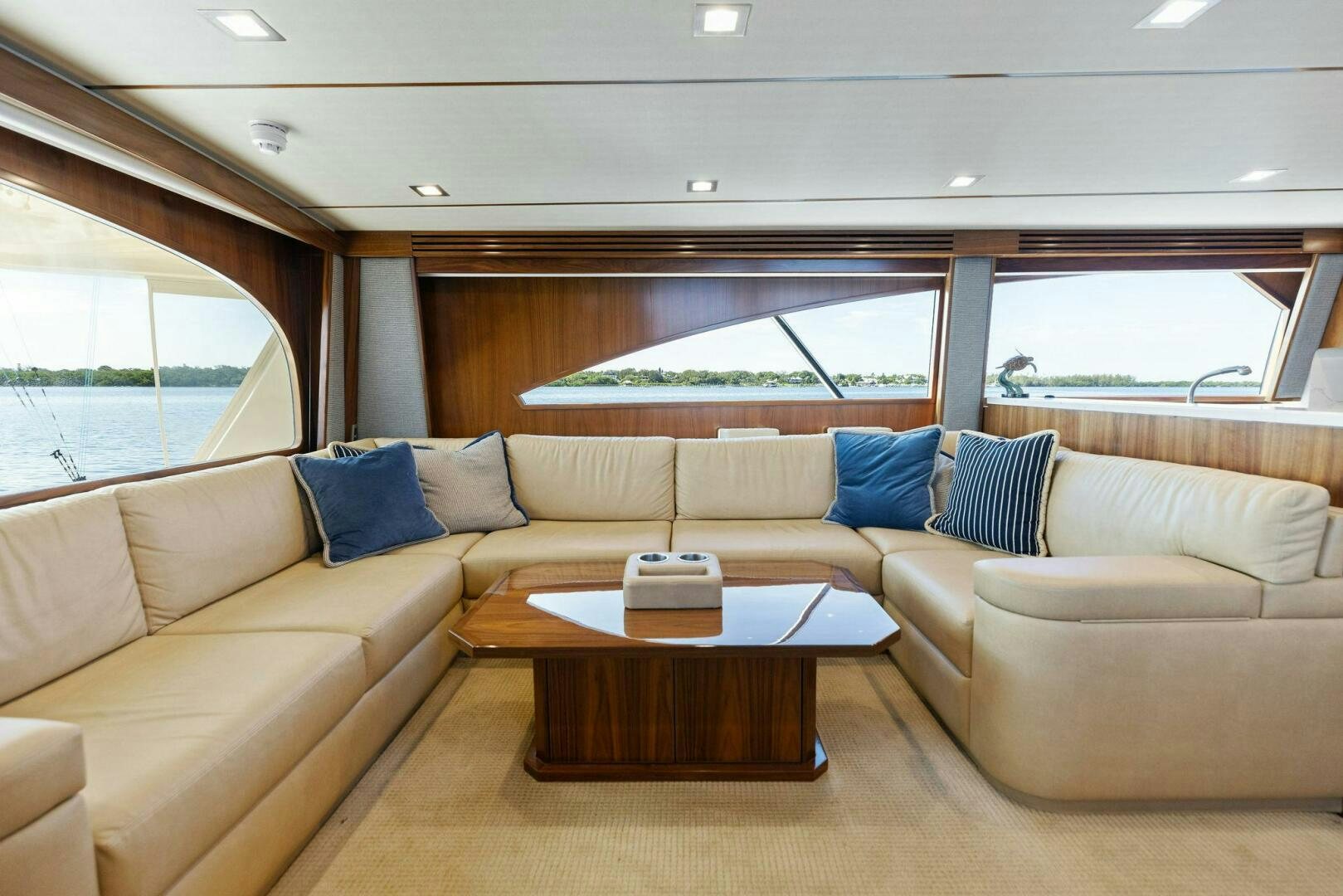a living room with couches and a table aboard WHISKEY PAPA Yacht for Sale