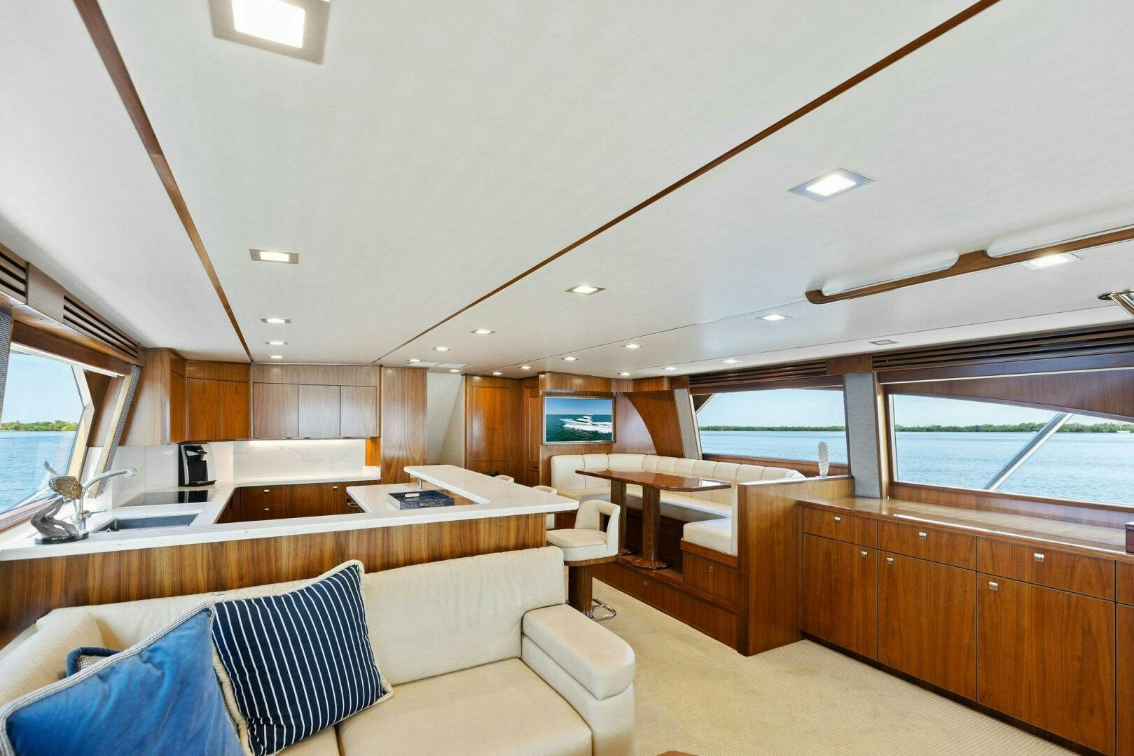 a large room with a couch and a table aboard WHISKEY PAPA Yacht for Sale