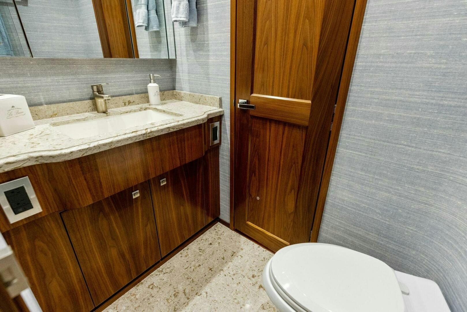 a bathroom with a sink and a toilet aboard WHISKEY PAPA Yacht for Sale
