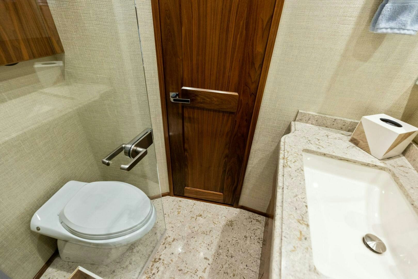 a bathroom with a toilet and sink aboard WHISKEY PAPA Yacht for Sale