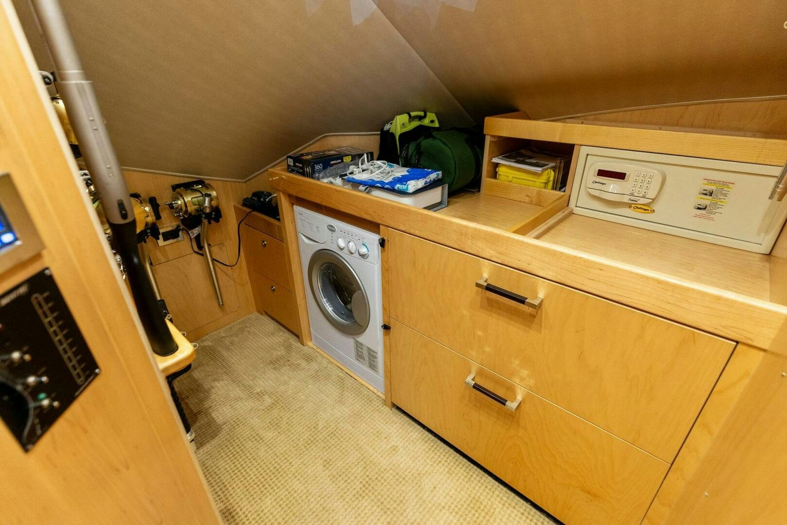 a laundry room with a washing machine aboard WHISKEY PAPA Yacht for Sale