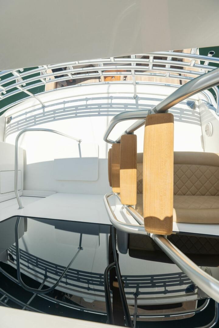 a large white boat with a wooden paddle on it aboard WHISKEY PAPA Yacht for Sale