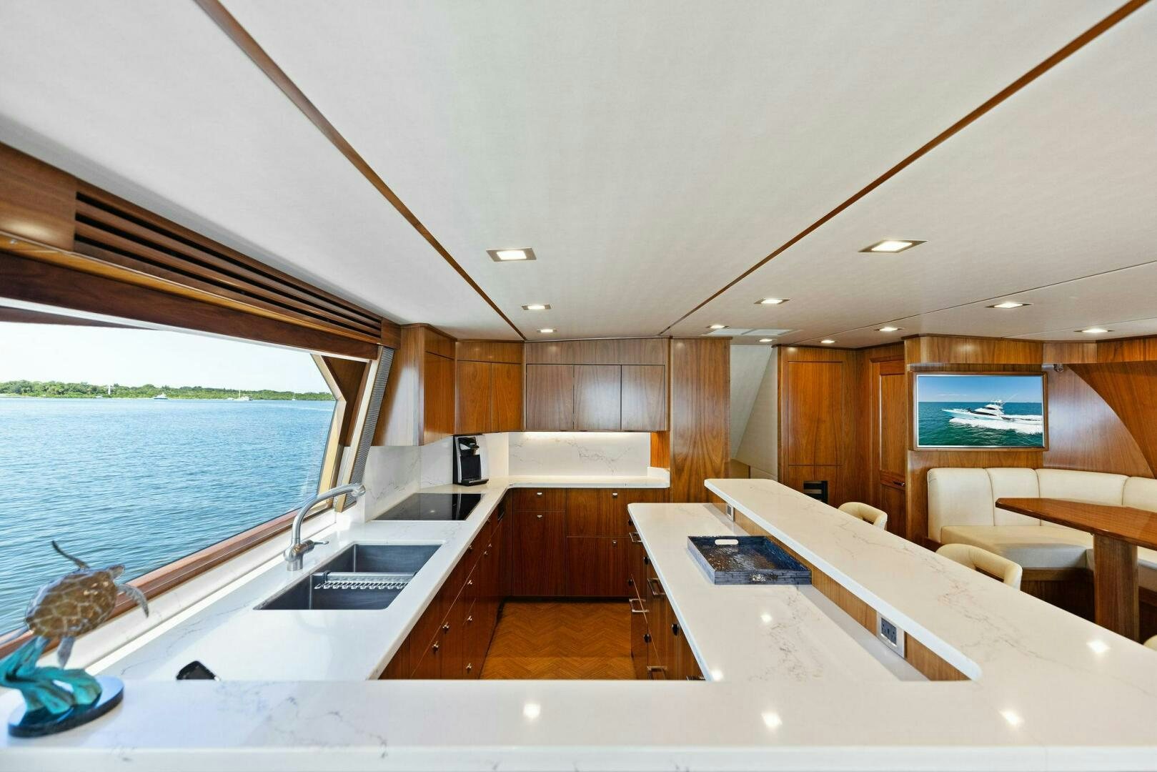 a large kitchen with a large window aboard WHISKEY PAPA Yacht for Sale