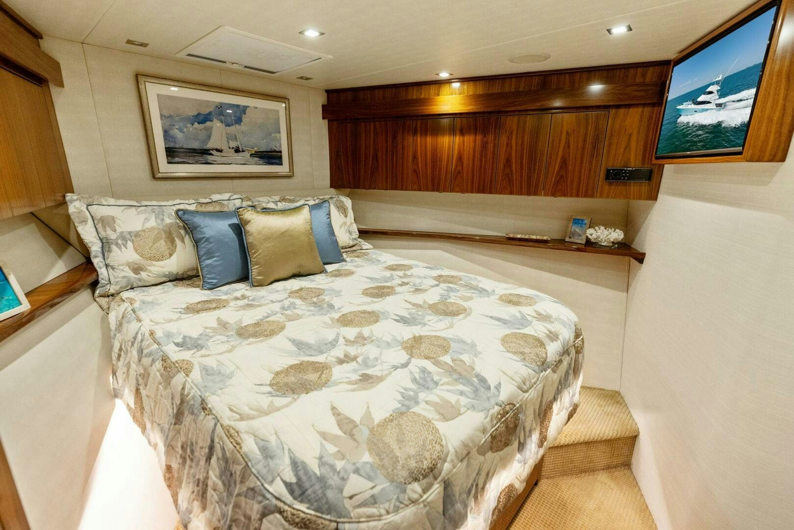a bed with a white comforter aboard WHISKEY PAPA Yacht for Sale