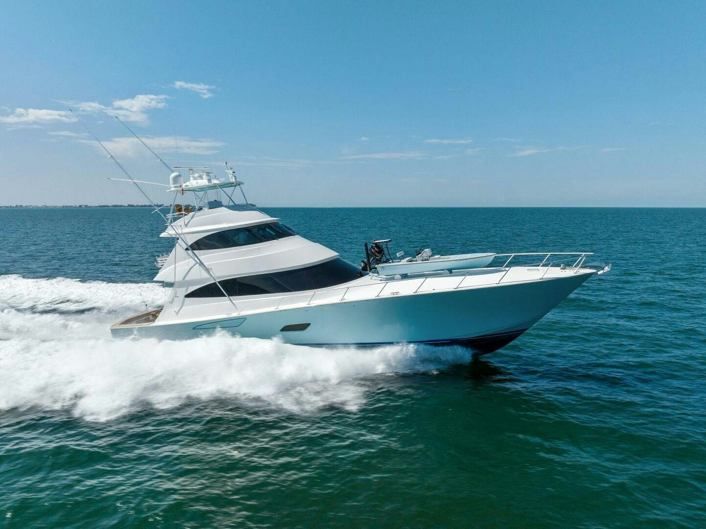 a white yacht on the water aboard WHISKEY PAPA Yacht for Sale