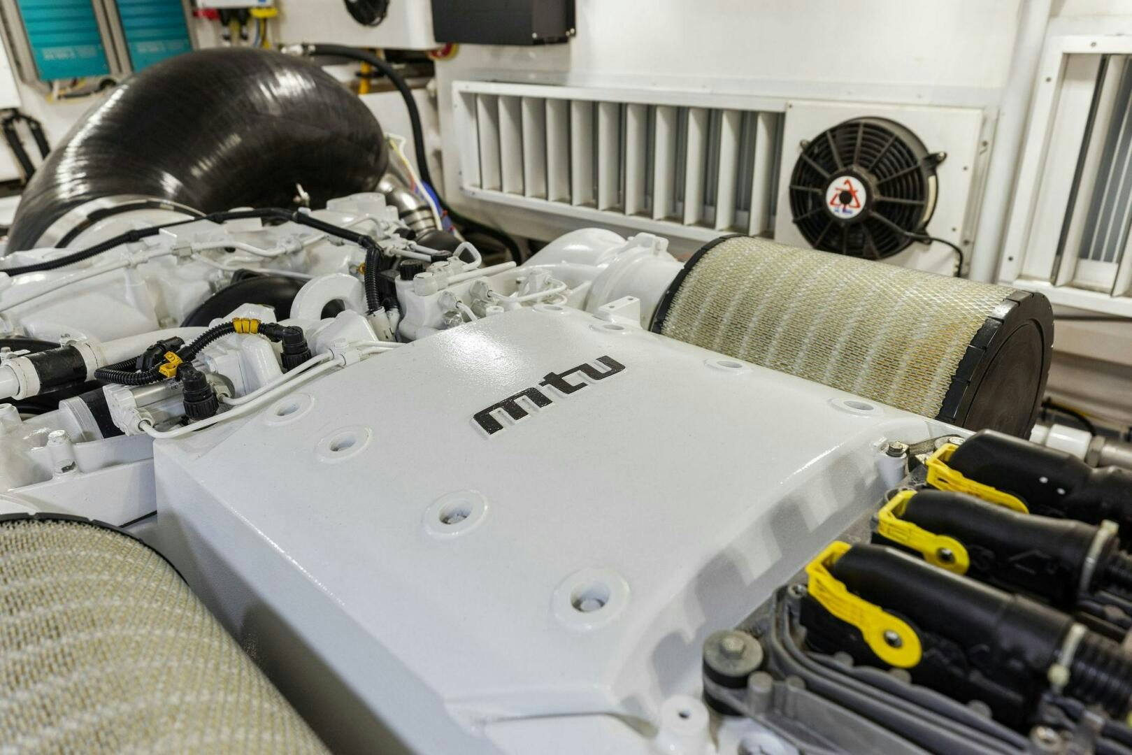 a white car with a white hood aboard WHISKEY PAPA Yacht for Sale