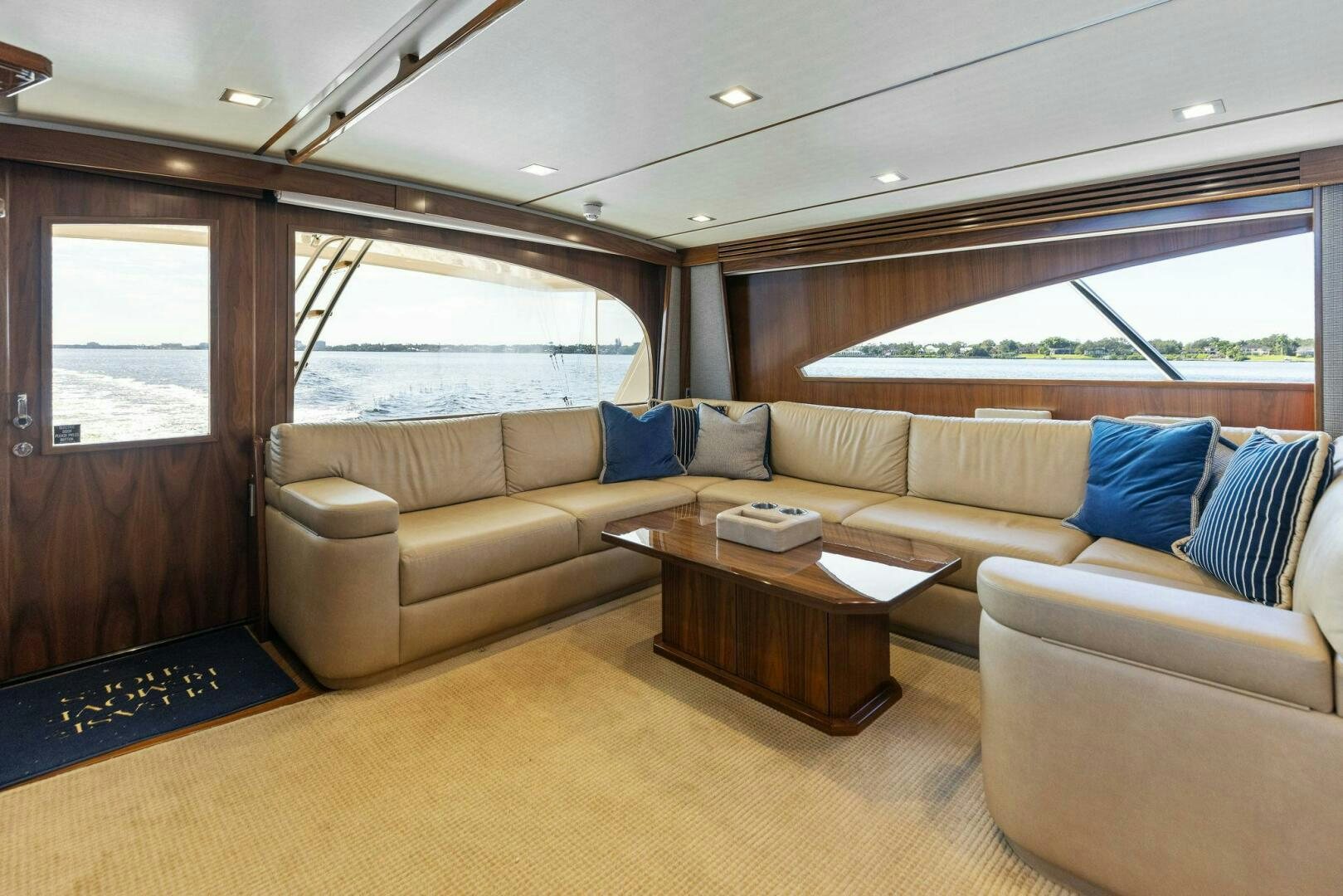 a living room with a couch and a table aboard WHISKEY PAPA Yacht for Sale