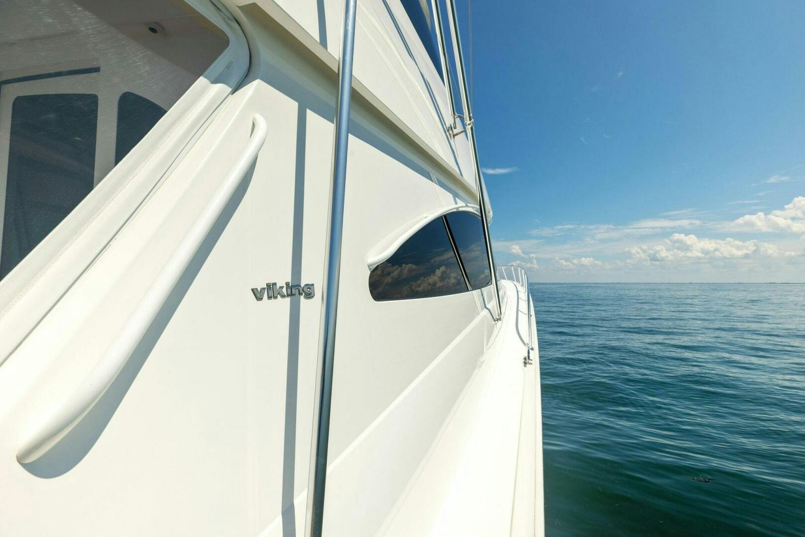 a white boat on the water aboard WHISKEY PAPA Yacht for Sale
