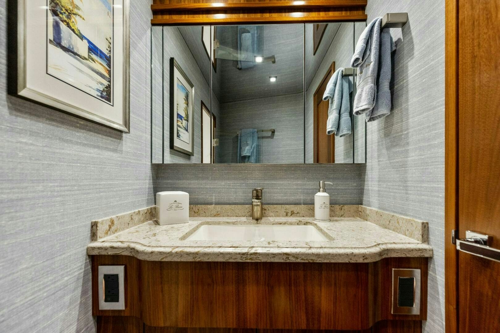 a bathroom with a large mirror aboard WHISKEY PAPA Yacht for Sale