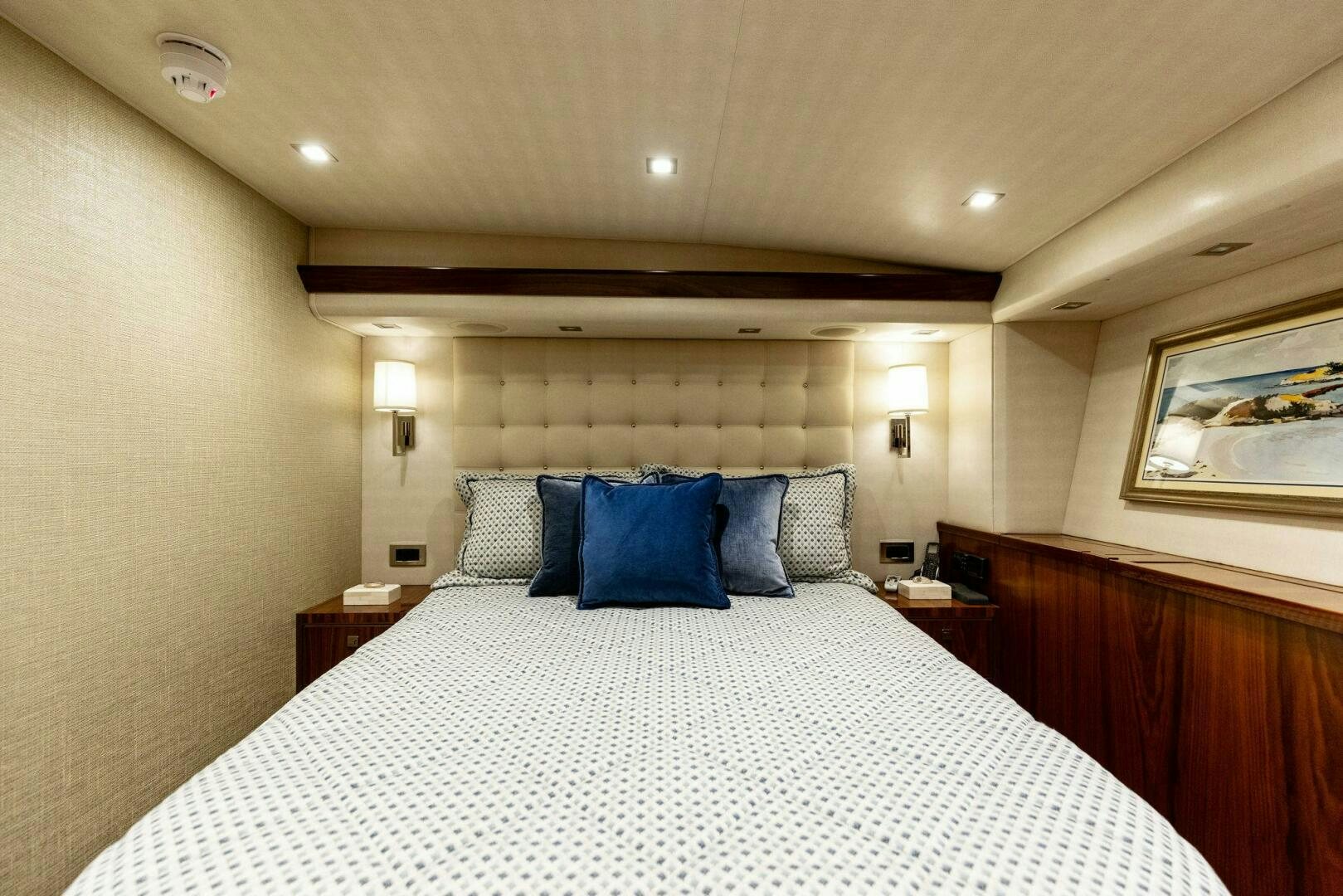 a bed with a white sheet and pillows aboard WHISKEY PAPA Yacht for Sale