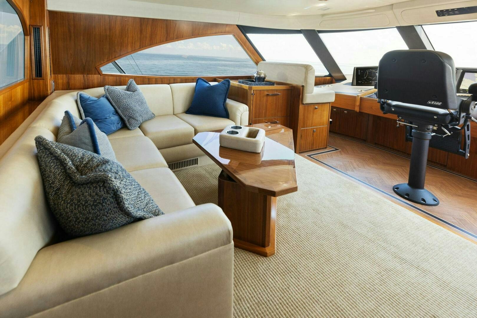 a living room with a couch and a television aboard WHISKEY PAPA Yacht for Sale