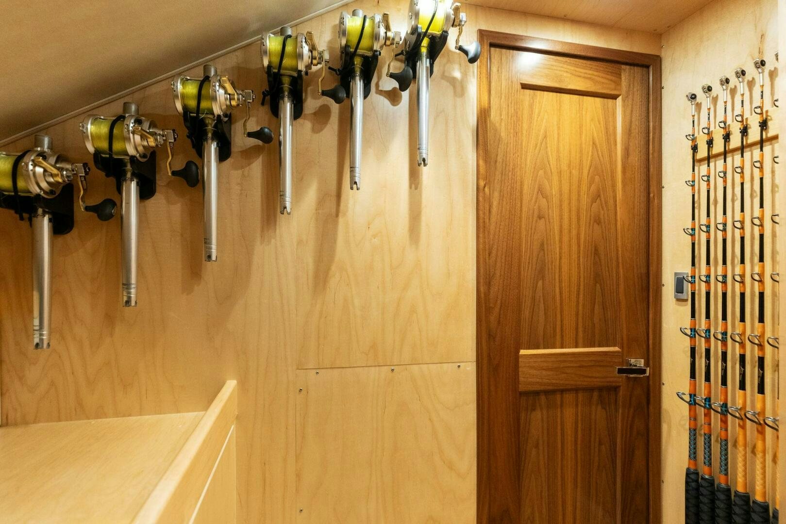a room with a wood door and a shelf with several lights aboard WHISKEY PAPA Yacht for Sale