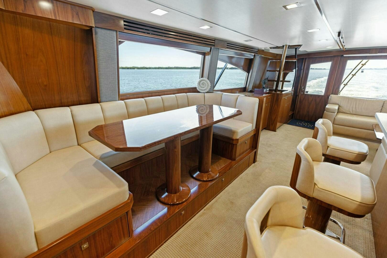 a room with a table and chairs aboard WHISKEY PAPA Yacht for Sale