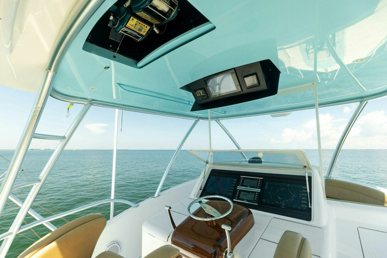 a boat with a seat and a steering wheel on the front aboard WHISKEY PAPA Yacht for Sale