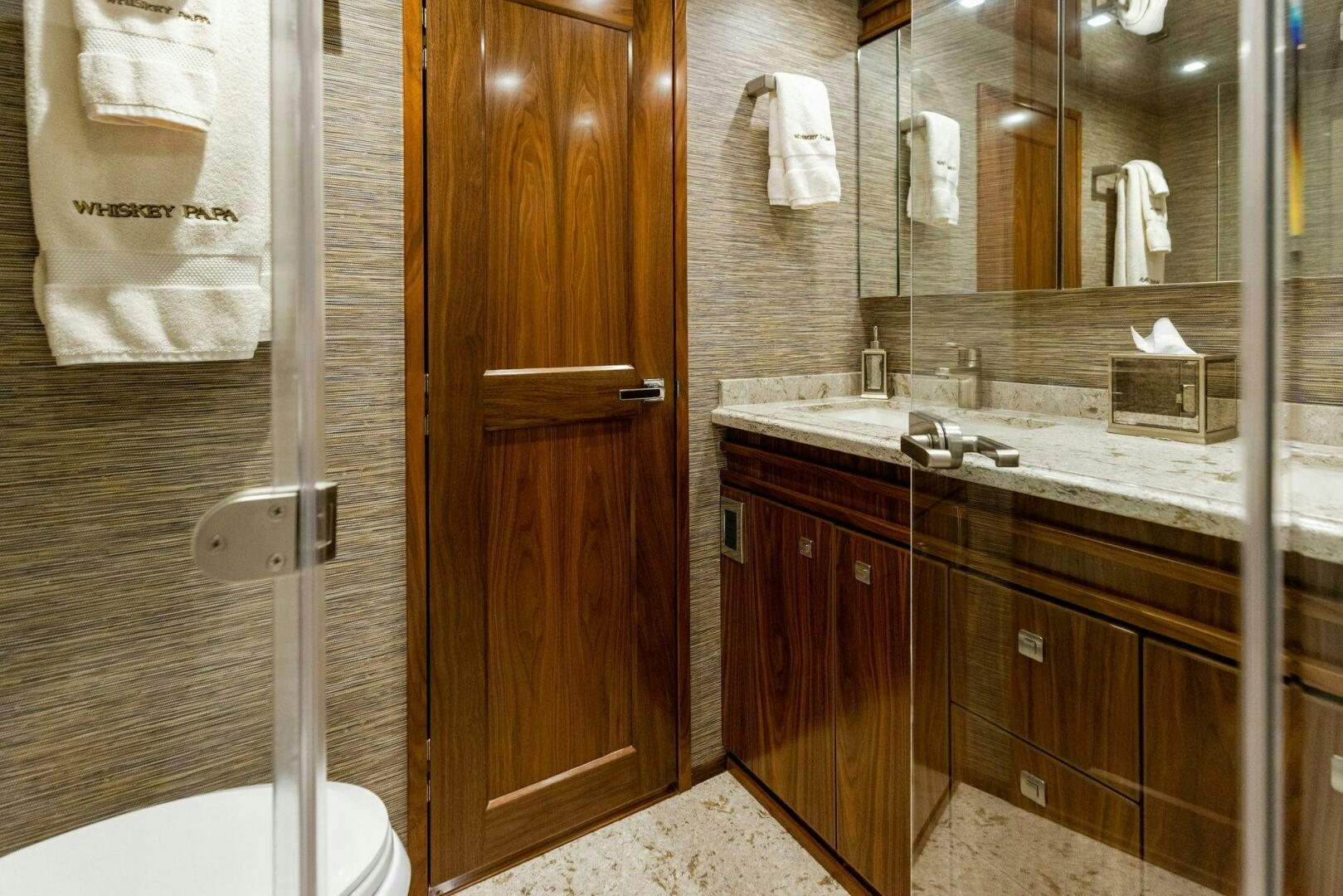 a bathroom with a sink and a mirror aboard WHISKEY PAPA Yacht for Sale