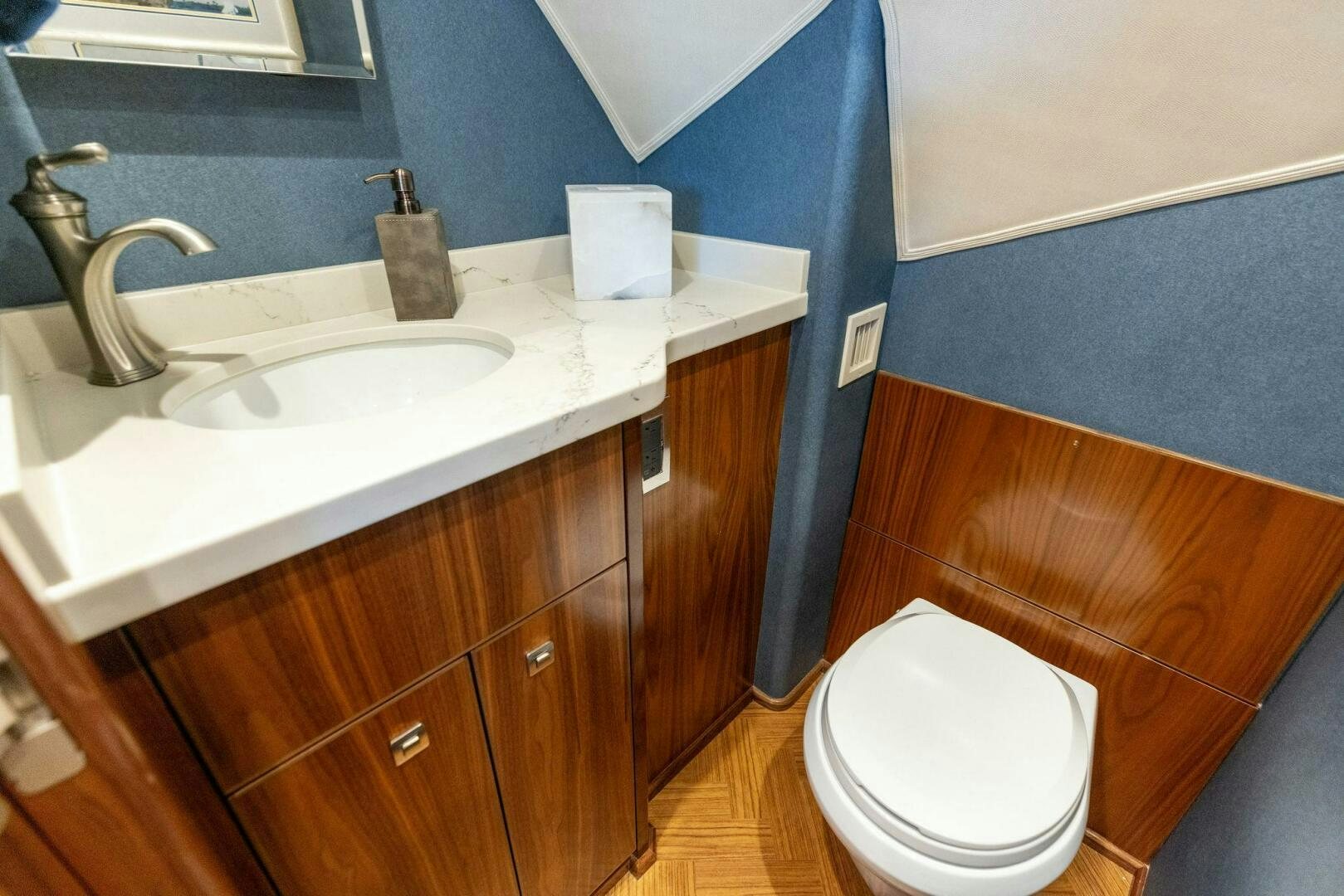 a bathroom with a sink and a toilet aboard WHISKEY PAPA Yacht for Sale