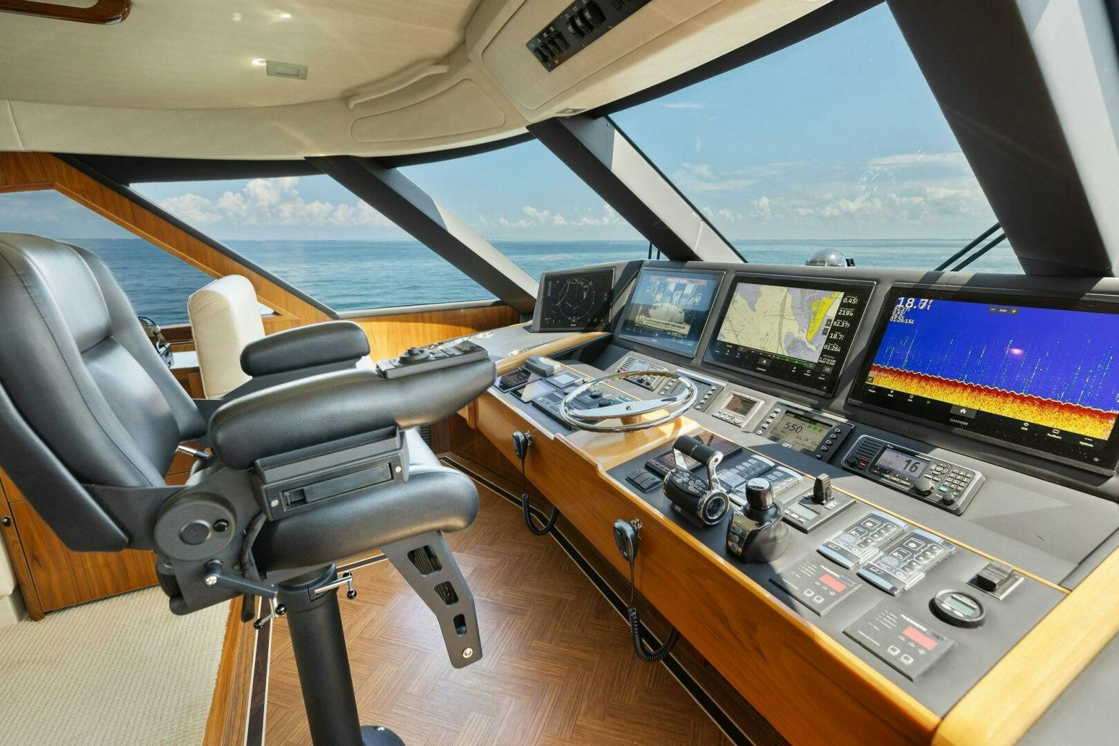 a cockpit with many monitors and computers aboard WHISKEY PAPA Yacht for Sale