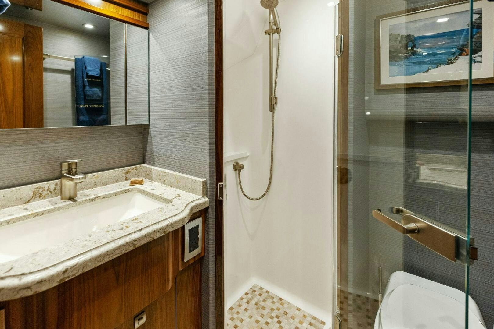 a bathroom with a sink and a mirror aboard WHISKEY PAPA Yacht for Sale