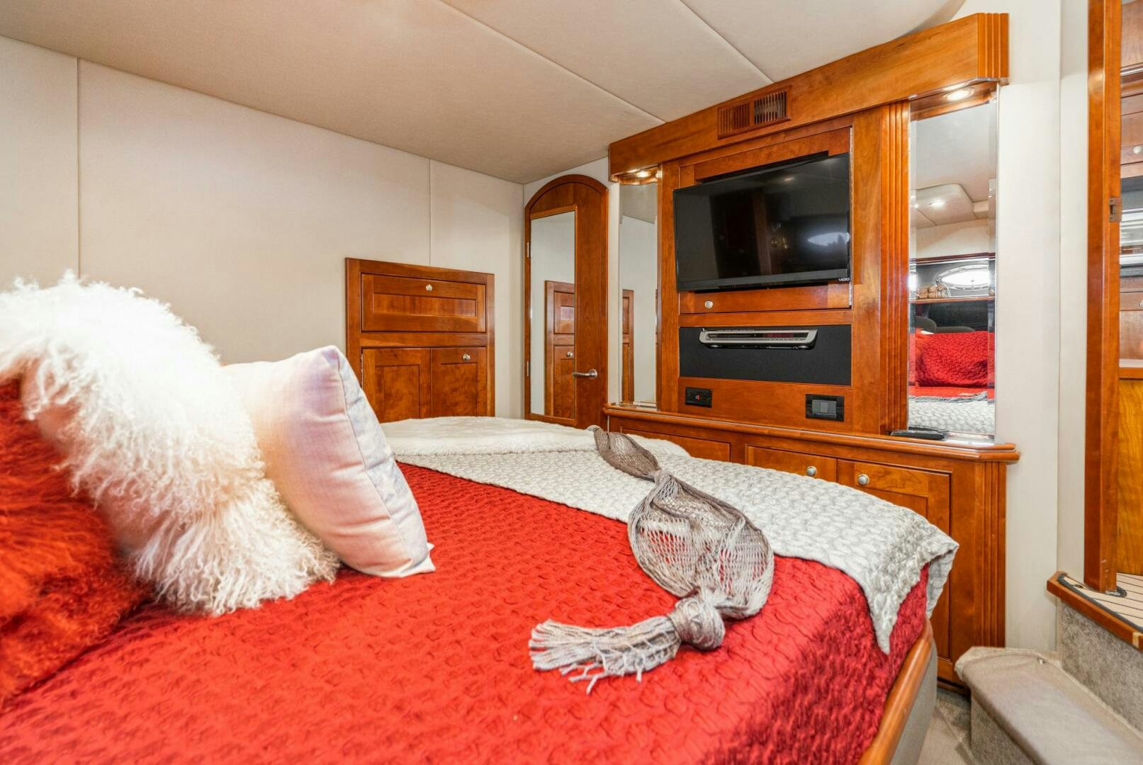 a cat sitting on a bed aboard MYSTIQUE Yacht for Sale