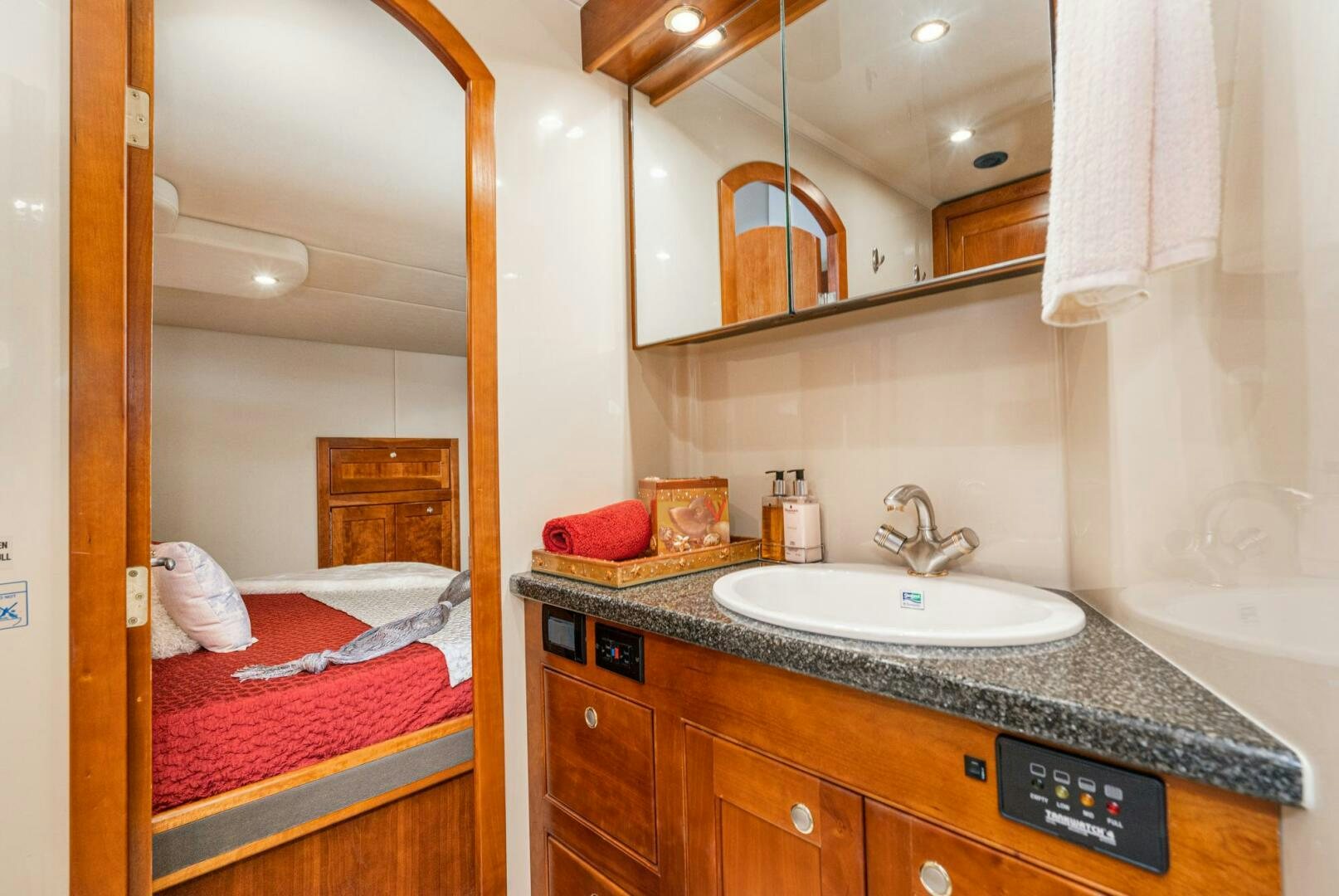 a bathroom with a sink and a mirror aboard MYSTIQUE Yacht for Sale