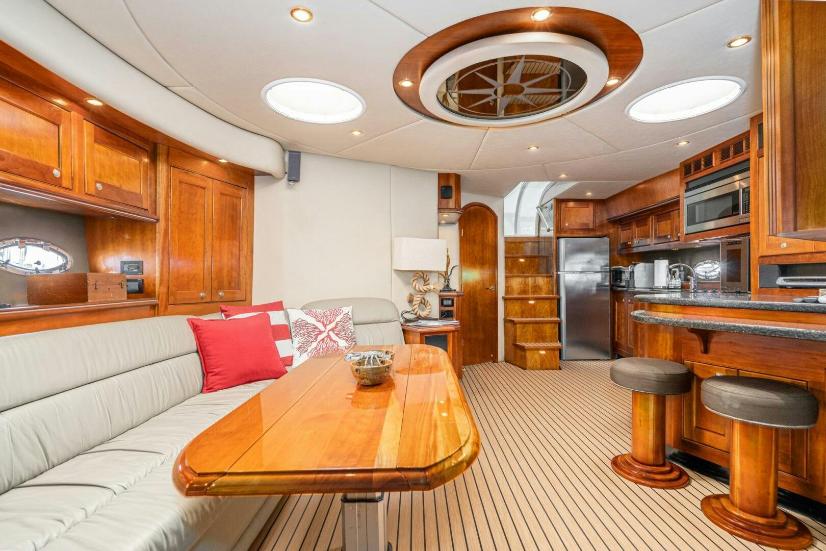 a living room with a couch and a table aboard MYSTIQUE Yacht for Sale