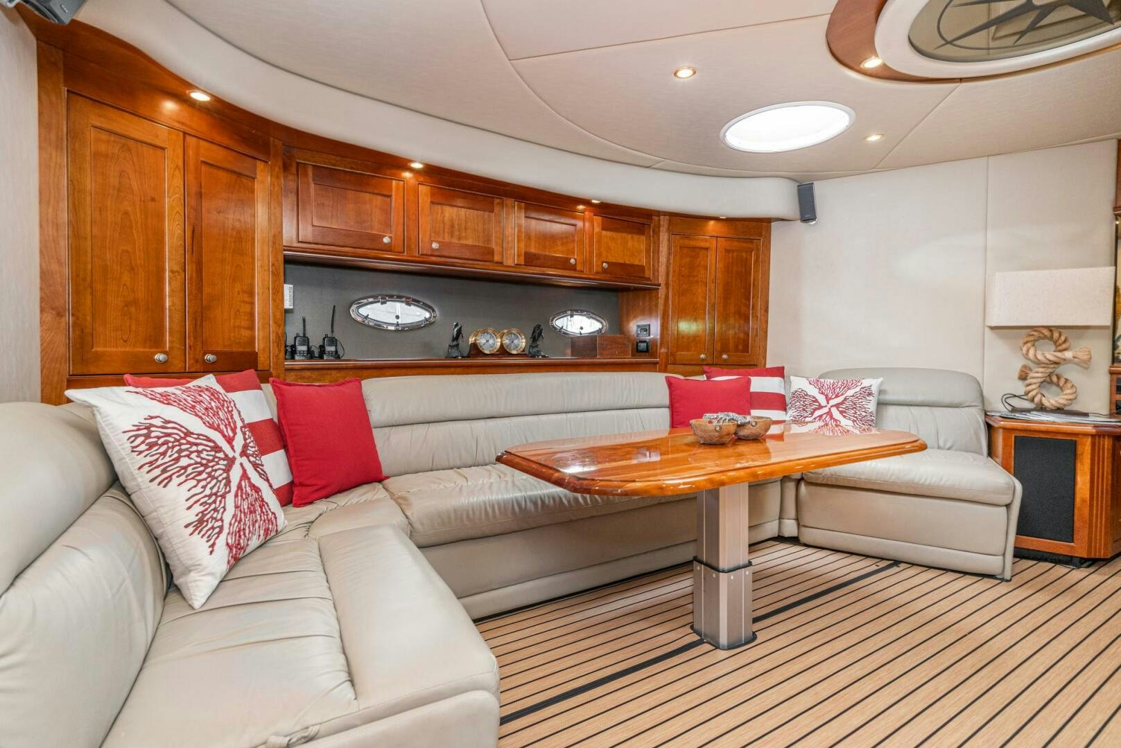 a living room with a couch and a table aboard MYSTIQUE Yacht for Sale