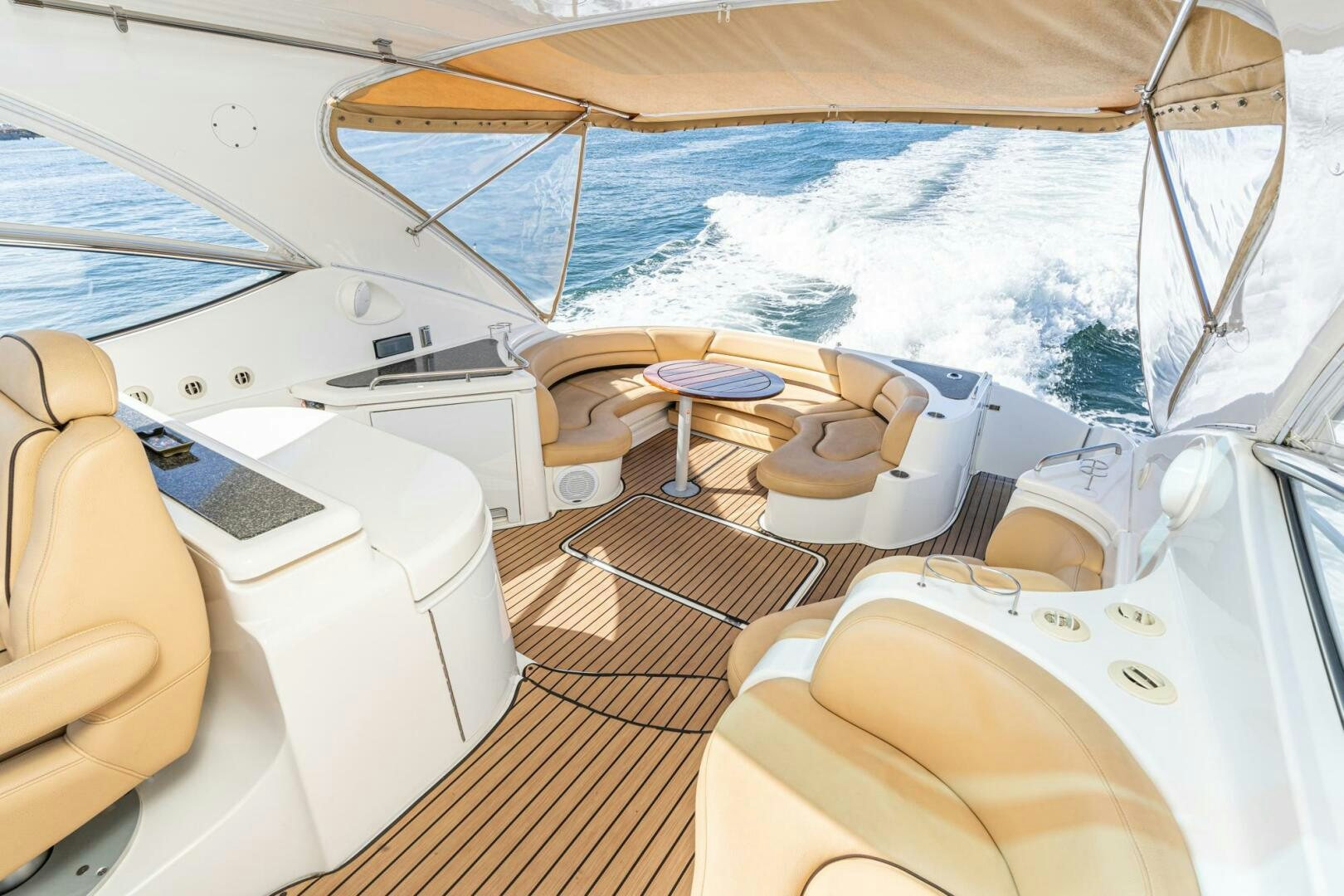 a boat with a deck and a table on it aboard MYSTIQUE Yacht for Sale