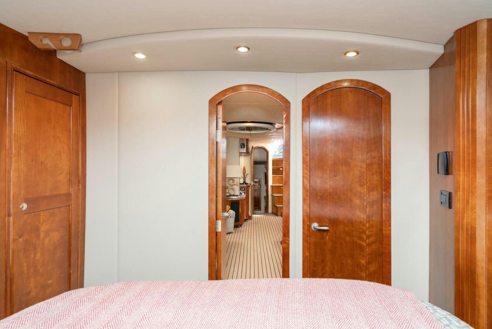 a hotel room with a double bed aboard MYSTIQUE Yacht for Sale