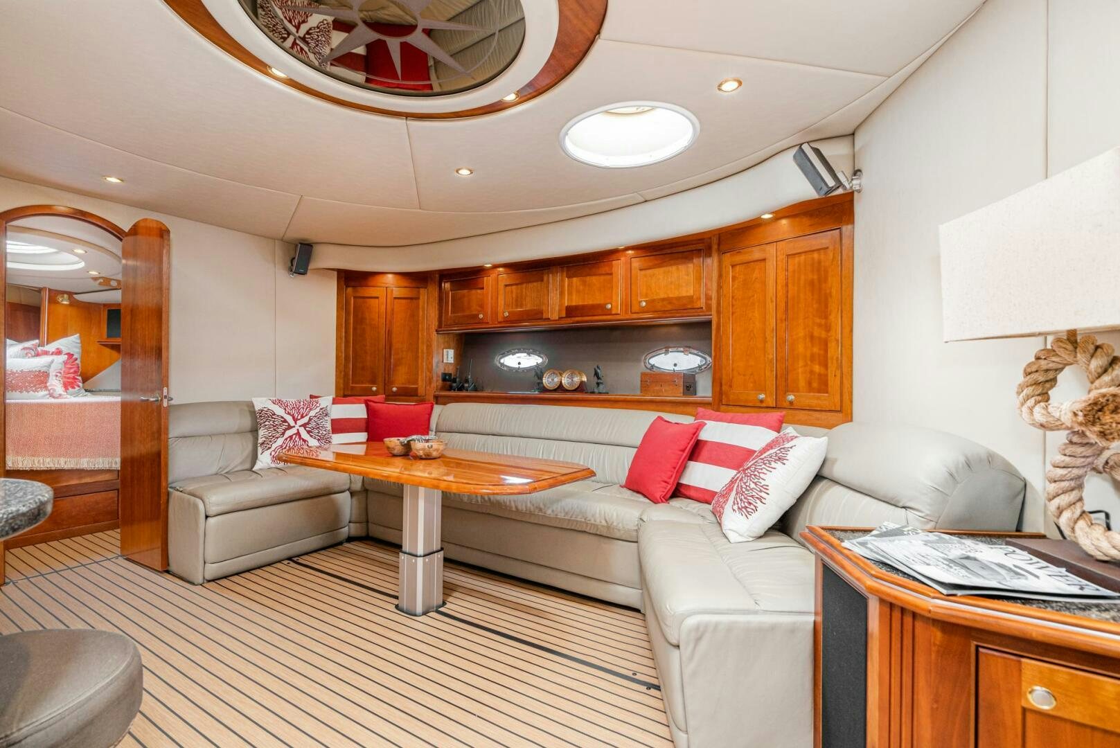 a living room with a couch and a table aboard MYSTIQUE Yacht for Sale