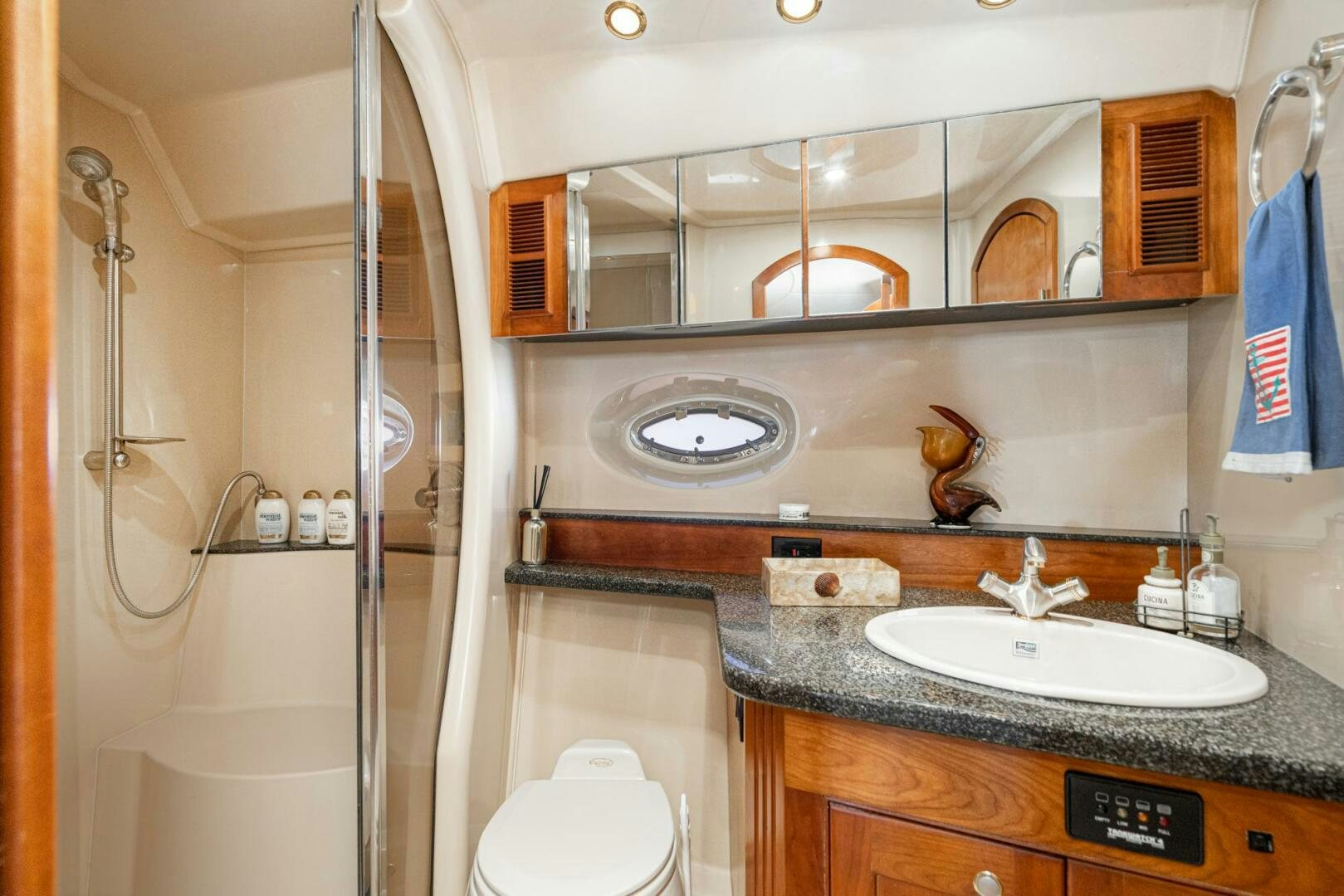 a bathroom with a large mirror aboard MYSTIQUE Yacht for Sale