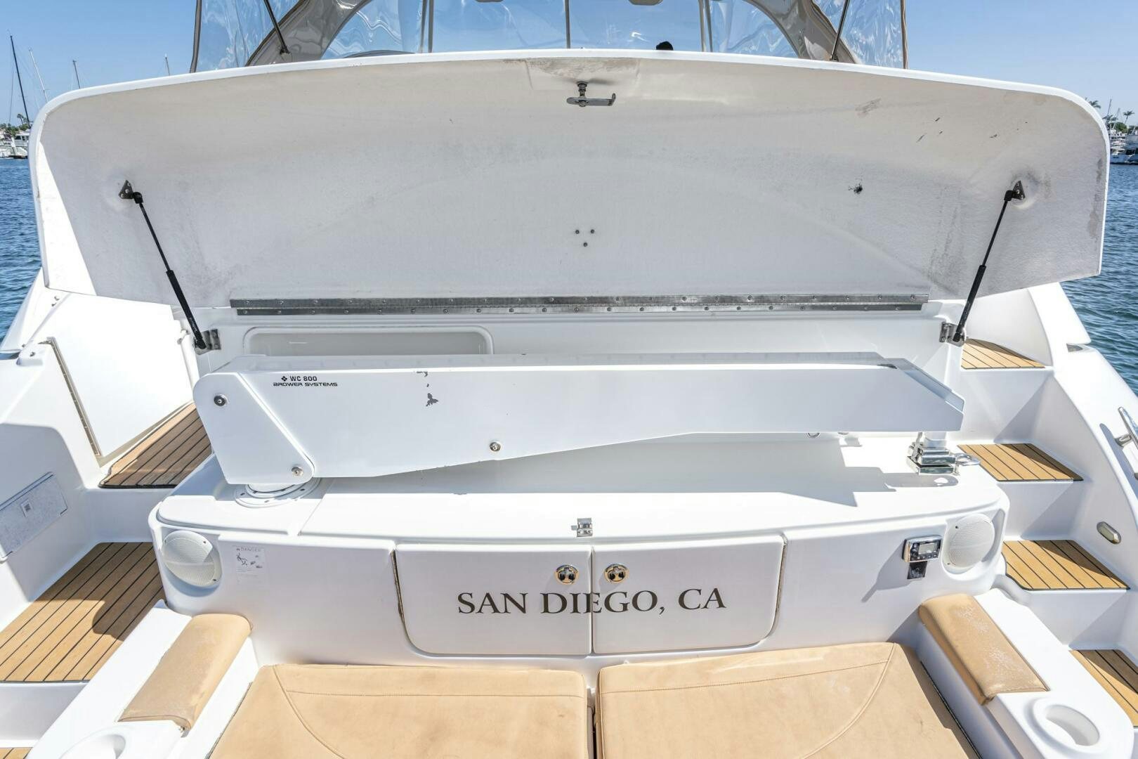 a white boat with a black frame aboard MYSTIQUE Yacht for Sale