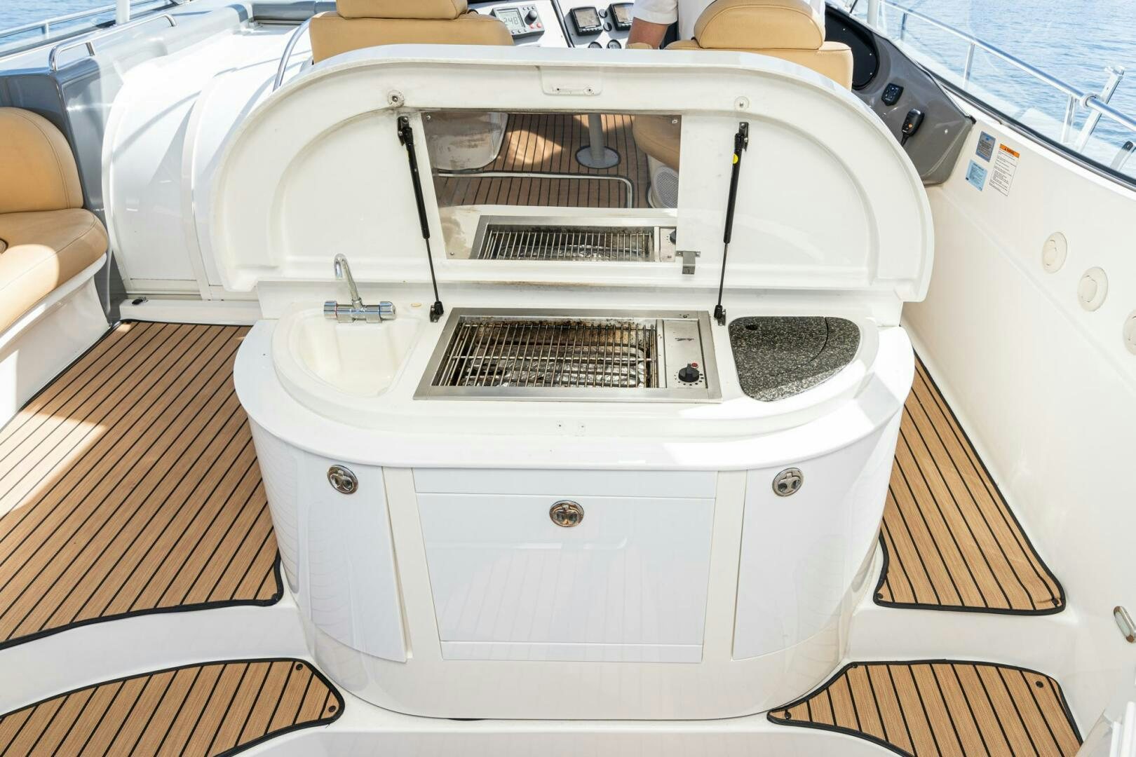 a white car with a door open aboard MYSTIQUE Yacht for Sale